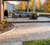 Well-maintained interlock paver patio in Amherst NY with clean joints, prepared for early winter frost protection.